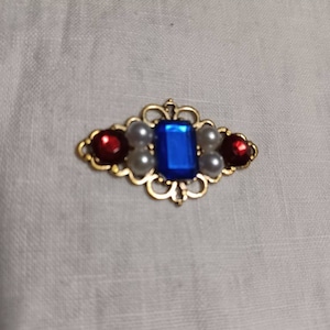 Blue, pearl, and red ouches