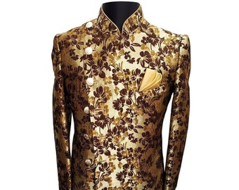 May include: A long-sleeved jacket in a gold and brown patterned fabric, featuring a mandarin collar and a single button fastening. The jacket has a diagonal hemline and a pocket on the left side, containing a gold and brown patterned handkerchief.