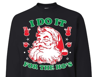 May include: Black Christmas jumper featuring a red and white illustration of Santa Claus with the text "I DO IT FOR THE HO'S".