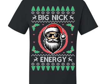May include: Black t-shirt with a festive design featuring a Santa Claus face wearing sunglasses and a red hat. The text "BIG NICK" and "ENERGY" are displayed above and below the Santa graphic, surrounded by Christmas-themed patterns.