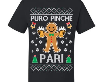 May include: Black t-shirt with a gingerbread man graphic holding two mugs of beer. The text "PURO PINCHE PARI" is above and below the gingerbread man, with snowflakes, bells, and Christmas trees.
