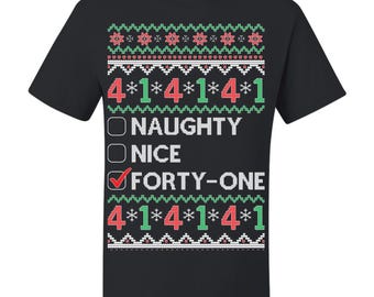 May include: Black t-shirt with a festive design. The design includes the text "4*1*4*1*4*1" above and below the words "NAUGHTY", "NICE", and "FORTY-ONE". The word "FORTY-ONE" has a checkmark. The design also features red, white, and green patterns.