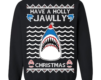 May include: Black sweatshirt with a shark wearing a Santa hat. The shark has a wide open mouth with sharp teeth. The text "HAVE A HOLLY JAWLLY CHRISTMAS" is printed above and below the shark in white.