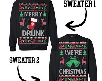 May include: Two black Christmas sweaters with festive designs. One sweater says "MERRY DRUNK" with a stocking graphic. The other says "WE'RE CHRISTMAS" with bells. Both have red, green, and white patterns.