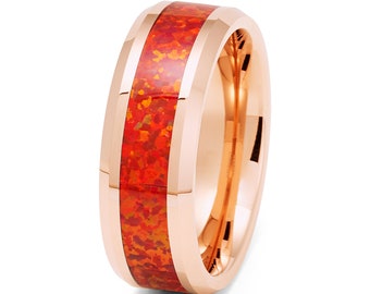 May include: A rose gold tungsten carbide ring with a red and orange opal inlay. The ring has a beveled edge and a polished finish.