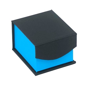 May include: A small, black gift box with a blue interior. The box has a hinged lid and a curved edge.