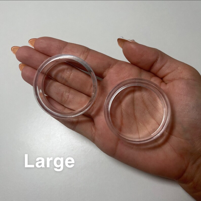 May include: Two clear plastic rings, one larger than the other, labelled "Large".