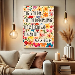 May include: A colorful floral print wall art with the text "This is the day that the Lord has made: Let us rejoice and be glad in it. Psalm 118:24".