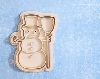 Sneeuwpop met bezem: koekjessnijder