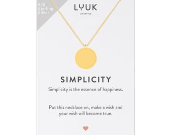 May include: A gold necklace with a round pendant that says "SIMPLICITY" on a white card. The card also says "Simplicity is the essence of happiness. Put this necklace on, make a wish and your wish will become true."