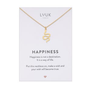 May include: Gold necklace with a snake pendant and a card that reads "Happiness is not a destination. It is a way of life. Put this necklace on, make a wish and your wish will become true."