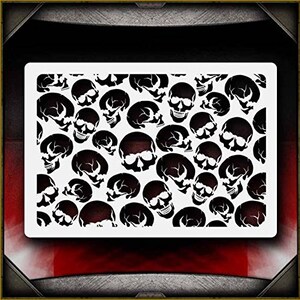 May include: A black and white stencil featuring a repeating pattern of skulls. The stencil is made of a durable material and is perfect for creating unique and spooky designs on a variety of surfaces.