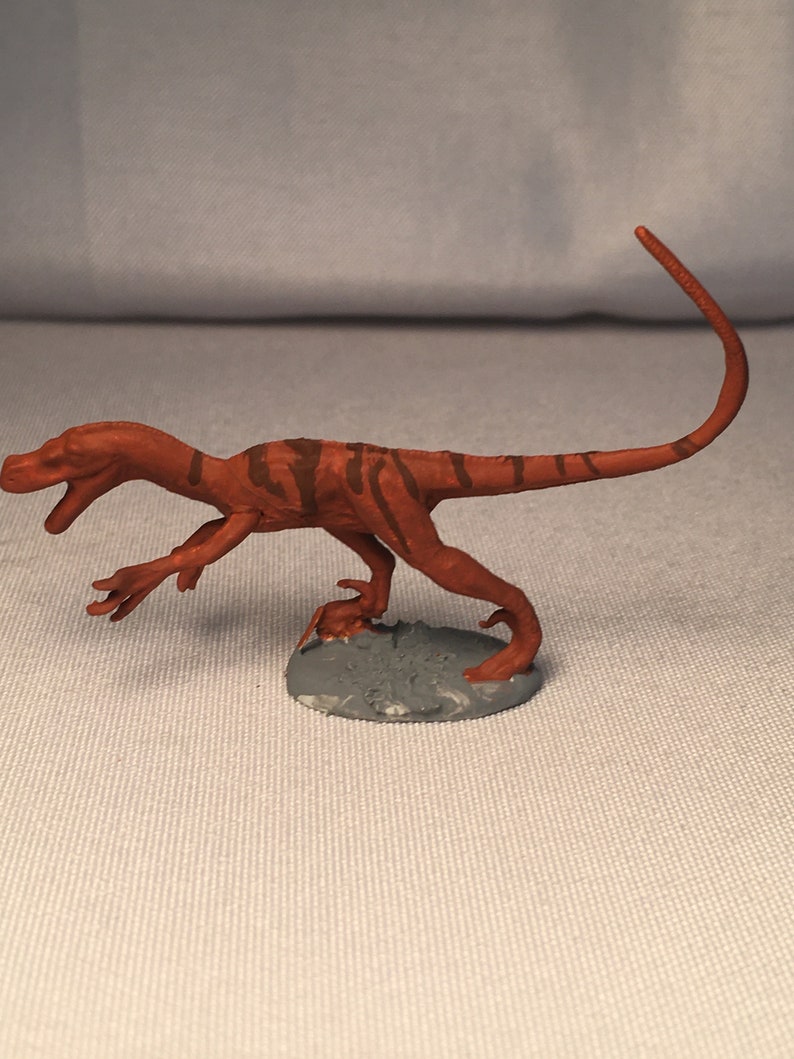 tiny velociraptor