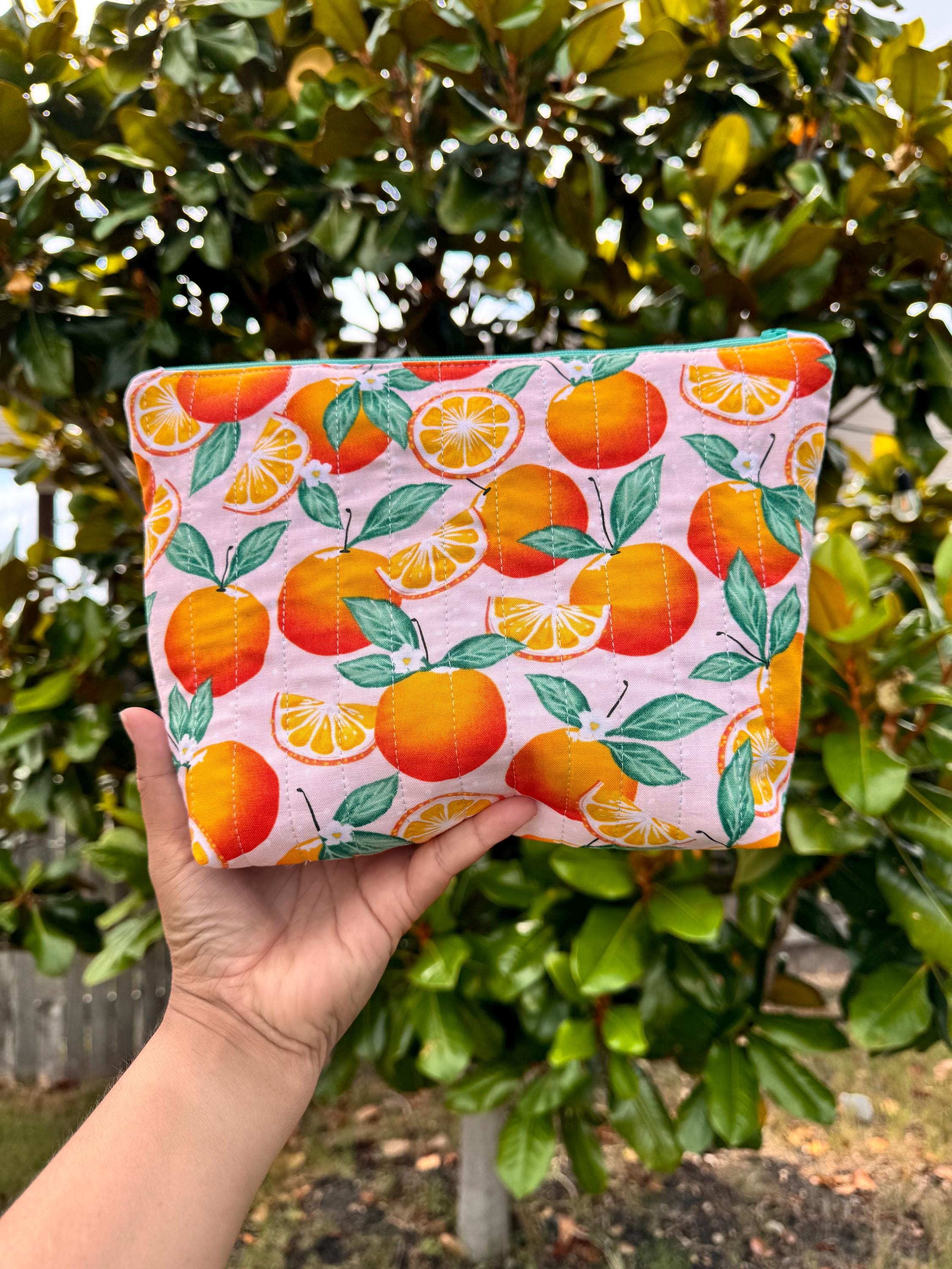 summer fruit quilted zipper pouch, bright colors make up bag, fun colors organizer bag, oranges lemons bag, zipper quilted bag, citrus print