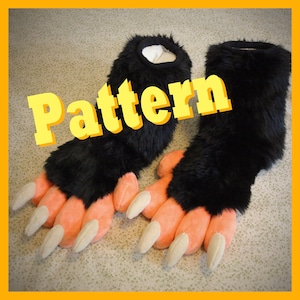 May include: A pair of black furry paw-style costume feet with peach-colored pads and long, off-white claws. The word "Pattern" is displayed in yellow block letters across the top of the image. The feet are designed to be worn as part of a costume.
