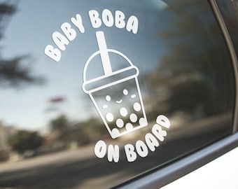 May include: White vinyl sticker with the text "Baby Boba on Board" and a cartoon image of a boba tea cup with a straw.