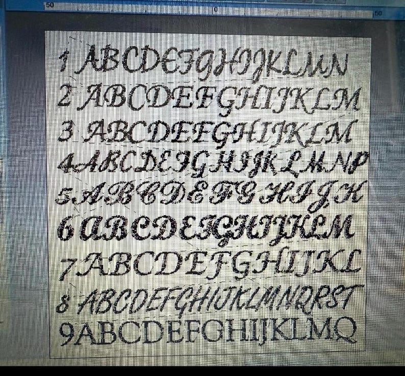 May include: A close-up of a grid with nine rows of the alphabet in a cursive font. Each row displays a different style of the alphabet, with variations in letter shapes and spacing. The letters are dark against a light background.