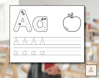 May include: A white printable worksheet featuring the uppercase and lowercase letter "A" with numbered directional guides for writing. An outline of an apple is also included. The worksheet has lines for practicing writing the letter "A". The text "Nikki Digital Prints" is in the bottom right corner.