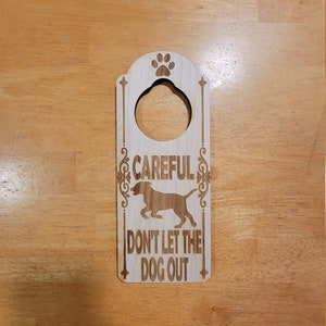 Don&#39;t Let The Dog Out Engraved Wooden Door Hanger Warning Sign