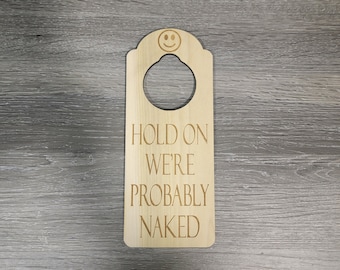 Hold On We&#39;re Probably Naked Engraved Door Hanger Sign