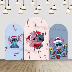 May include: Three arched panels featuring cartoon characters in Santa hats and Christmas themes. The panels are light blue, pink, and blue, with candy cane patterns. The characters include Stitch and Angel from Lilo & Stitch, holding candy canes and Christmas lights.