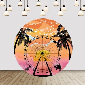 May include: A circular backdrop featuring a black silhouette of a Ferris wheel against an orange and pink sunset sky. The scene includes palm tree silhouettes, small birds, and a string of glowing white fairy lights draped across the upper portion.