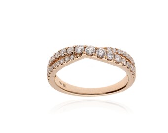 May include: A rose gold ring with a curved design, set with multiple small, clear gemstones. The ring has a double-band appearance, with the gemstones arranged along the top. The ring is on a white background.