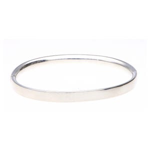 May include: A set of three ceramic mugs with a speckled, matte finish. The mugs are in shades of cream, light gray, and dark gray. Each mug has a simple, minimalist design, perfect for coffee or tea.