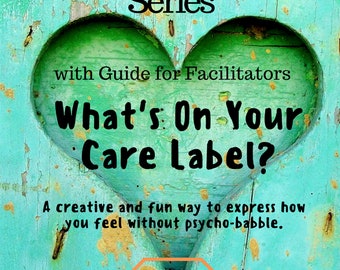 May include: A teal blue wooden heart with the text "What's On Your Care Label?" in black. The text "Creative Self-Expression Workbook Series" is above the heart and the text "with Guide for Facilitators" is below the heart. The text "100% Human Correct Gently Do Not Tickle..." is in a white box with a black outline. The text "Phyllis Capanna, MA, OTR/L" is at the bottom of the image.