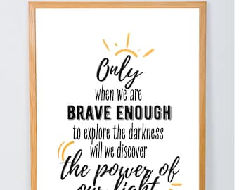 May include: A motivational quote by Brene Brown in a black frame on a white background. The quote reads "Only when we are BRAVE ENOUGH to explore the darkness will we discover the power of our light."