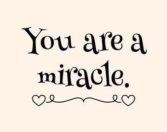May include: Black and white text on a light pink background that reads "You are a miracle." with two small hearts on either side of a decorative swirl.