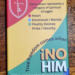 May include: A rectangular card with a shield-shaped "faith" logo. The card features text about spiritual struggles, with colour-coded categories. The phrase "True freedom comes when iNO HIM" is prominently displayed.