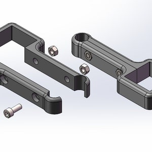 May include: An exploded view of several dark grey mechanical components. The parts include two bracket-like pieces, a connecting bar, a handle with a square opening, nuts, and bolts. The components are arranged against a light background.
