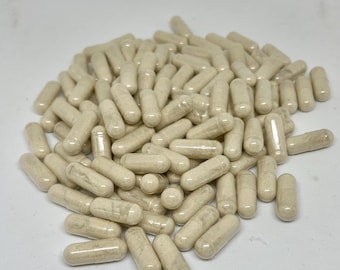 May include: A large pile of off-white capsules. The capsules are made of clear plastic and contain a white powder.