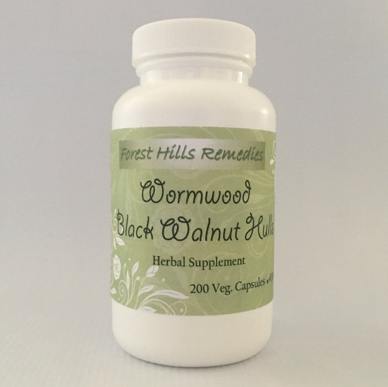 May include: White plastic bottle with a green label that reads "Forest Hills Remedies Wormwood Black Walnut Hulls Herbal Supplement 200 Veg. Capsules"