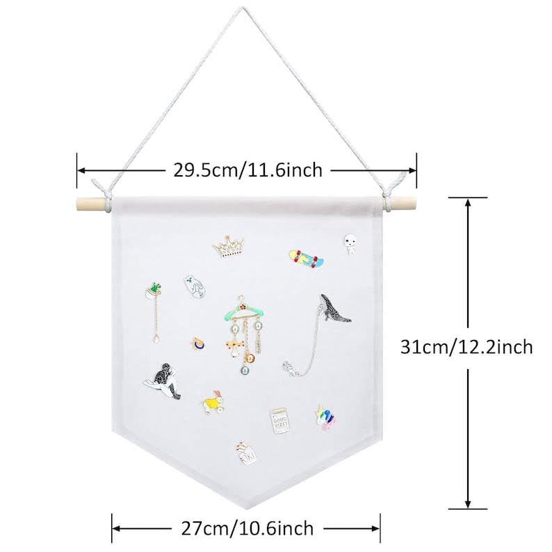 May include: White fabric jewelry organizer, 12.2 inches long and 10.6 inches wide, with a wooden dowel and hanging string. The fabric is decorated with various embroidered jewelry pieces, including a crown, a skateboard, and a cat.