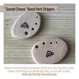 May include: Two beech wood herb strippers with a light wood grain. Each has a black graphic and several holes of varying sizes. The text "Second Chance" Beech Herb Strippers is at the top.