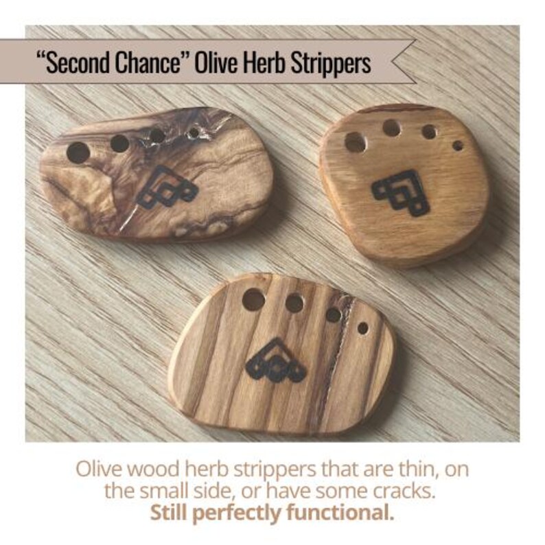 May include: Three olive wood herb strippers with a dark geometric design and holes for stripping herbs. The text reads "Second Chance" Olive Herb Strippers. The text also says the strippers are thin, small, or have cracks, but are still functional.