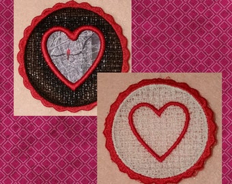 May include: Two free-standing lace hearts, one with a black background and one with a white background. Both hearts have a red outline and are made of a delicate lace fabric. The text "Free Standing Lace Hearts #3" is displayed below the hearts.