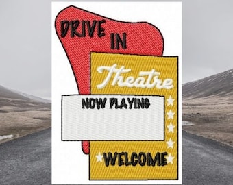 May include: Embroidered drive-in theater sign with red, yellow, and white text. The sign reads "DRIVE IN", "Theatre", "NOW PLAYING", and "WELCOME". The sign measures 2.73 x 3.88 inches.