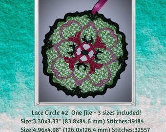 May include: A green and pink lace circle embroidery design with a black outline. The design is available in three sizes: 3.30 inches, 4.96 inches, and 6.28 inches.