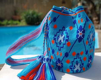 Wayuu mochila bag in single thread. Handmade wayuu bag. Traditional Wayuu Drawing made in blue and orange. Premium quality.