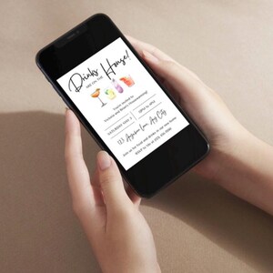 May include: A smartphone displaying a digital invitation to a housewarming party. The invitation features a white background with black text and colorful illustrations of cocktails. The text reads "Drinks are on the House!"  "You're invited to Victoria and Brian's Housewarming"  "Saturday May 3  6PM to 9PM"  "123 Apgaten Lane, Any City"  "Join us for food and drinks in our new home"  "RSVP to Me at 234-367-7088"