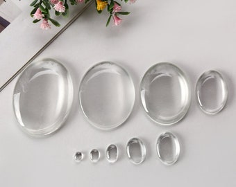Pode incluir: Conjunto de cabochões de vidro transparente em vários tamanhos e formas, ideais para artesanato e fabricação de joias.