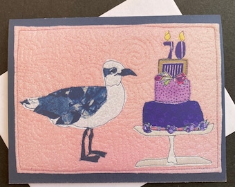 70th birthday card, seagull with cake and message. Folded card printed from original mixed media art. Beach-lover Big Birthday card.