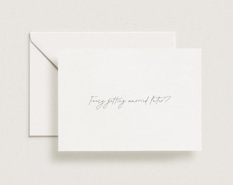 May include: A white card with the text "Fancy getting married later?" written in black cursive.