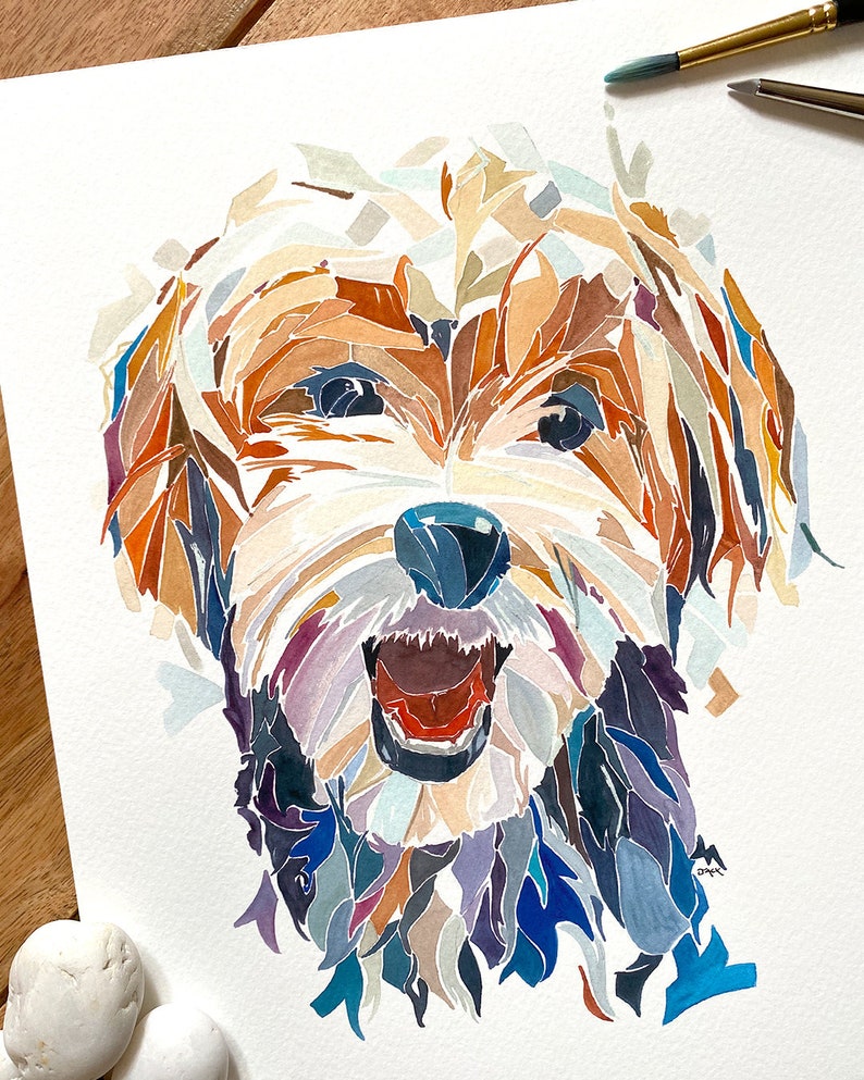 May include: Watercolour painting of a dog's face. The dog is a terrier mix with brown, white and black fur. The dog's mouth is open and its tongue is sticking out. The painting is done in a colourful, abstract style.