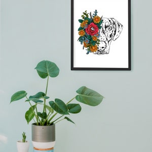 May include: Black and white line art illustration of a dog's head with colorful flowers covering one eye. The flowers are red, yellow, blue, and green.