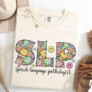 Speech Language Pathologist Shirt, Comfort Colors®, SLP Tshirt, Speech Therapy, Speech Pathology, Happy Face SLP, Flowers, SLP Gift