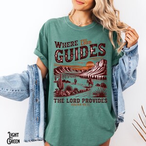 May include: A green t-shirt with a sunset scene and the text "Where the Lord Guides, The Lord Provides, Isaiah 58:11".